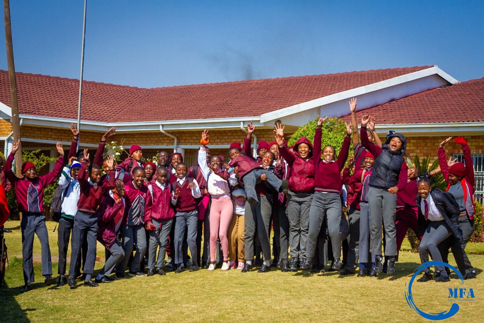 Group of students celebrating outdoors